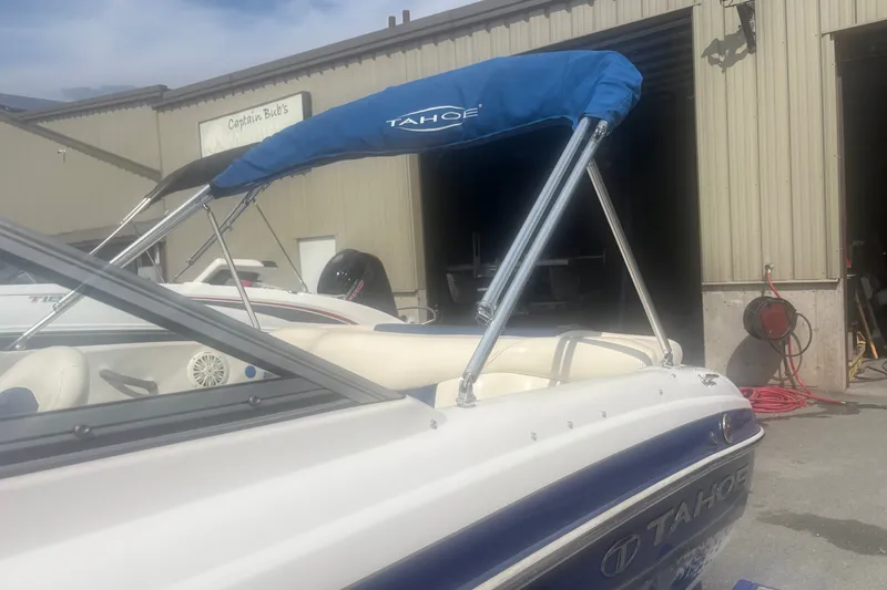 Slide: The Image of 2011 Tahoe Q4 SF boat with blue canopy at Captain Bub's. - 8
