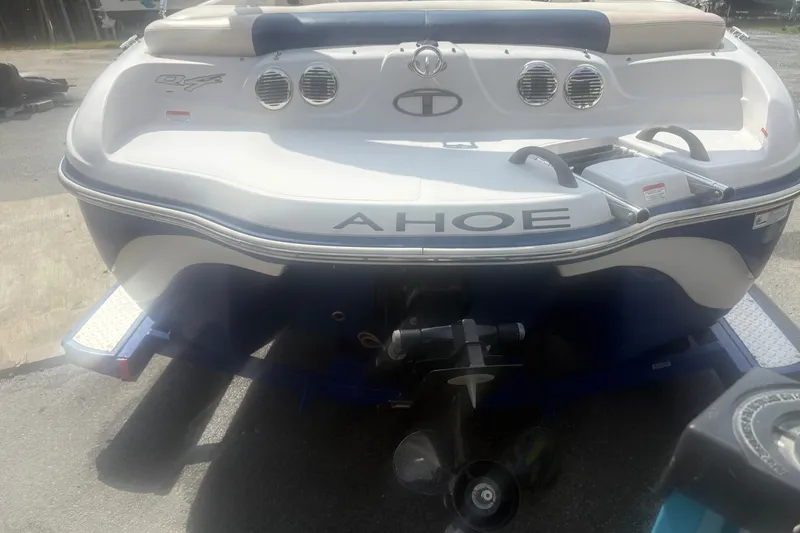 Slide: The Image of Rear view of a 2011 Tahoe Q4 SF boat on a trailer. - 2