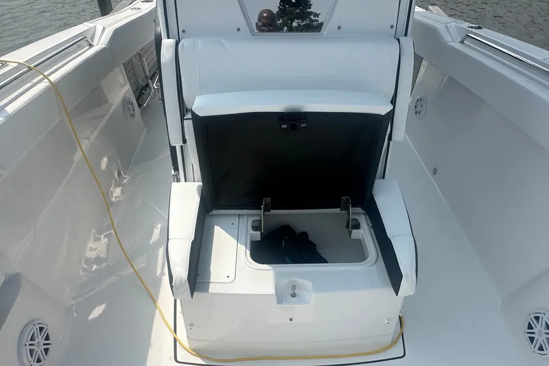 Slide: The Image of 2024 Blackfin 272 CC boat interior with open storage compartment and seating. - 31