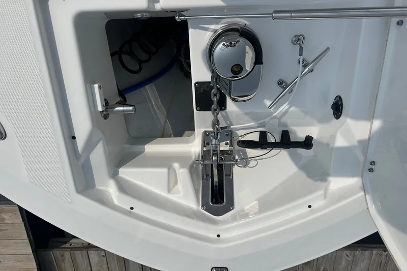 Slide: The Image of 2024 Blackfin 272 CC boat anchor compartment with chain and winch system. - 36