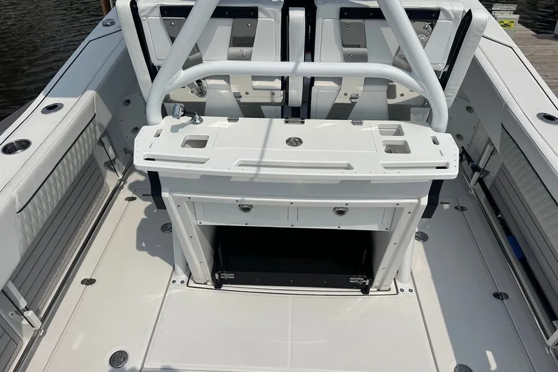 Slide: The Image of 2024 Blackfin 272 CC boat interior with seating and storage compartments. - 18