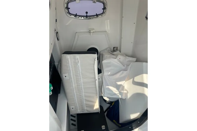 Slide: The Image of Interior cabin of 2024 Blackfin 272 CC boat, featuring storage and seating. - 27