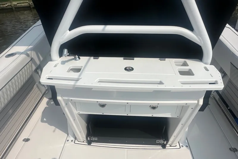 Slide: The Image of 2024 Blackfin 272 CC boat console with storage and cup holders. - 7