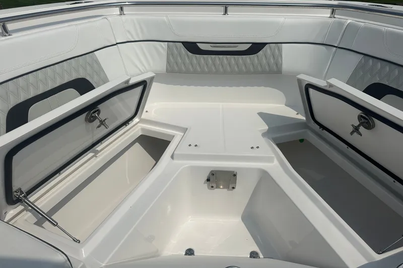 Slide: The Image of 2024 Blackfin 272 CC boat interior with open storage compartments. - 34