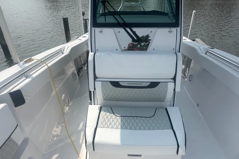 Slide: The Image of 2024 Blackfin 272 CC boat interior with white seating and sleek design. - 29