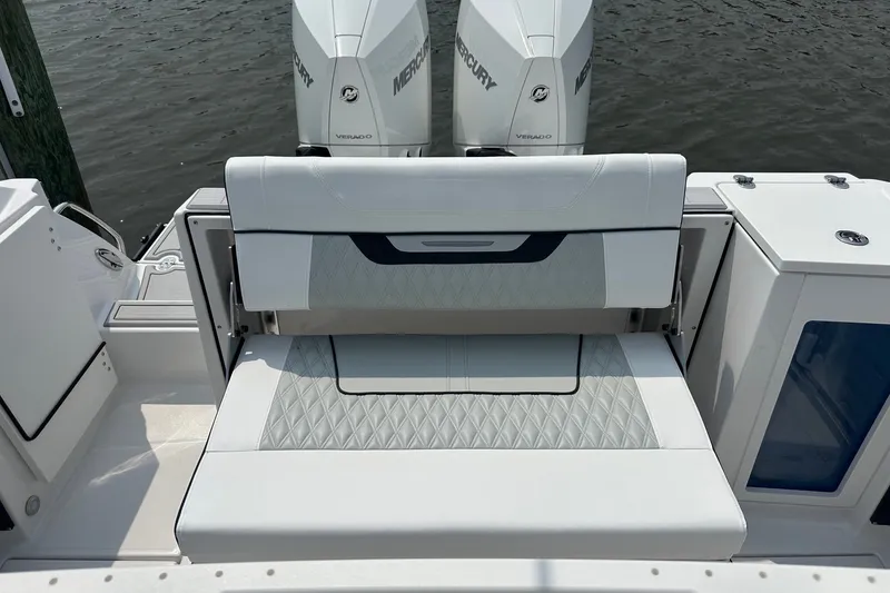 Slide: The Image of 2024 Blackfin 272 CC boat with dual Mercury engines and cushioned seating. - 14