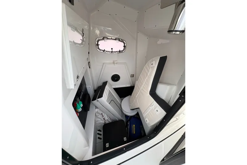 Slide: The Image of 2024 Blackfin 272 CC cabin interior with seating and storage compartments. - 26