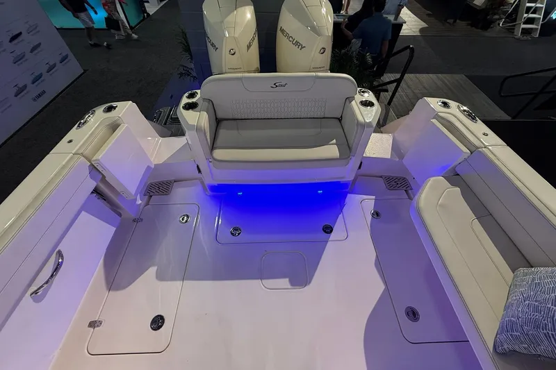 Slide: The Image of 2026 Scout 288 Dorado boat interior with seating and blue LED lighting. - 23