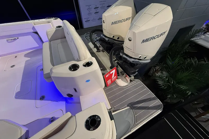 Slide: The Image of 2026 Scout 288 Dorado boat with dual Mercury engines, featuring a spacious seating area. - 25