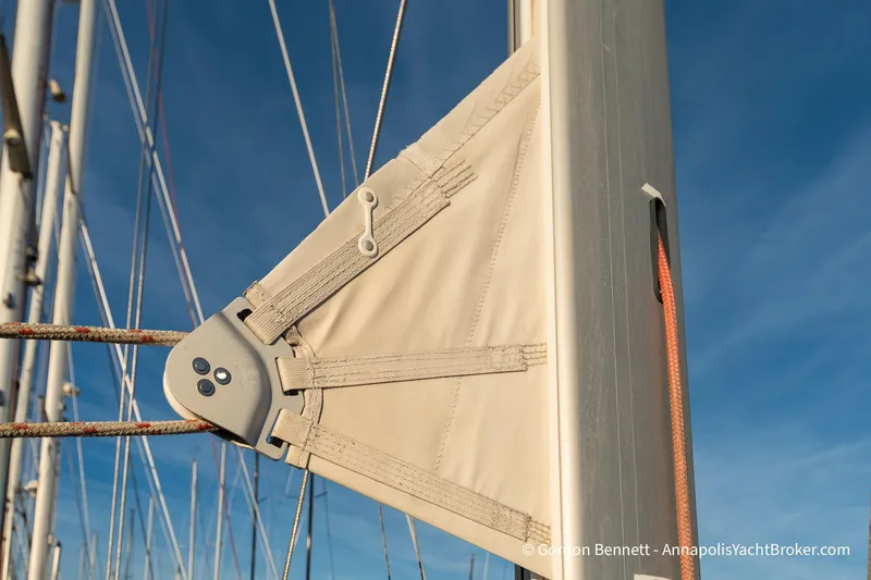 Slide: The Image of Close-up of Jeanneau Sun Odyssey 43 DS sail rigging, 2004 model, against clear blue sky. - 21
