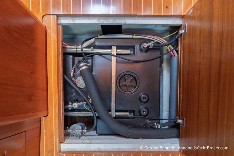 Slide: The Image of Engine compartment of 2004 Jeanneau Sun Odyssey 43 DS sailboat, showcasing internal components. - 56