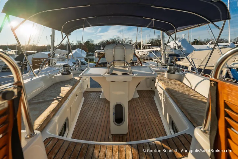 Slide: The Image of 2004 Jeanneau Sun Odyssey 43 DS yacht cockpit with wooden deck and canopy. - 29