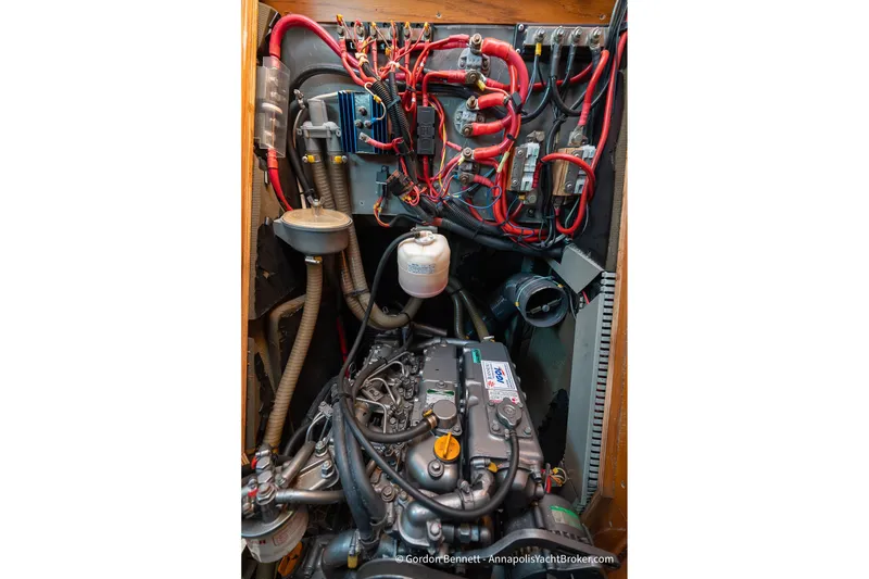 Slide: The Image of Engine compartment of 2004 Jeanneau Sun Odyssey 43 DS sailboat, showcasing wiring and components. - 60