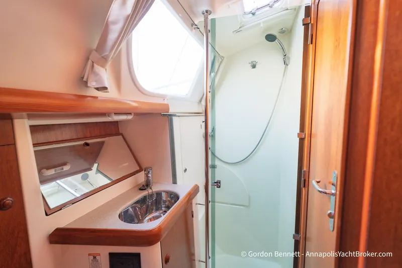 Slide: The Image of Interior of 2004 Jeanneau Sun Odyssey 43 DS yacht bathroom with sink and shower. - 46