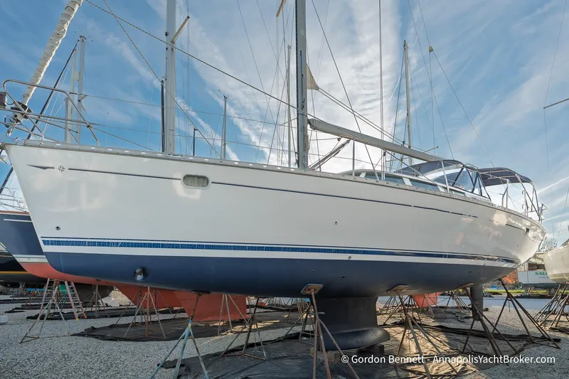 The Image of 2004 Jeanneau Sun Odyssey 43 DS sailboat on stands, clear sky background. - 0