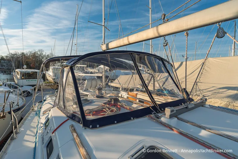 Slide: The Image of 2004 Jeanneau Sun Odyssey 43 DS sailboat docked at marina under clear sky. - 16
