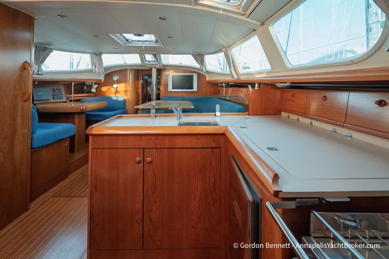 Slide: The Image of Luxurious interior of 2004 Jeanneau Sun Odyssey 43 DS yacht with wood finish and modern amenities. - 35
