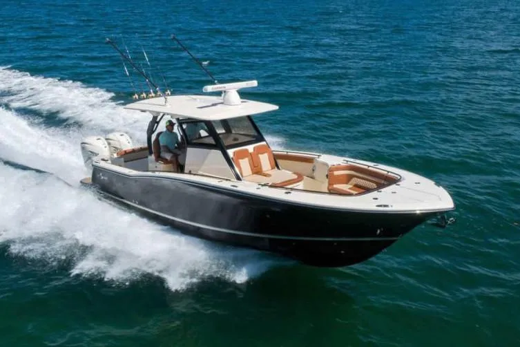The Image of Manufacturer Provided Image: 2025 Scout 330 LXF boat cruising on open water. - 0
