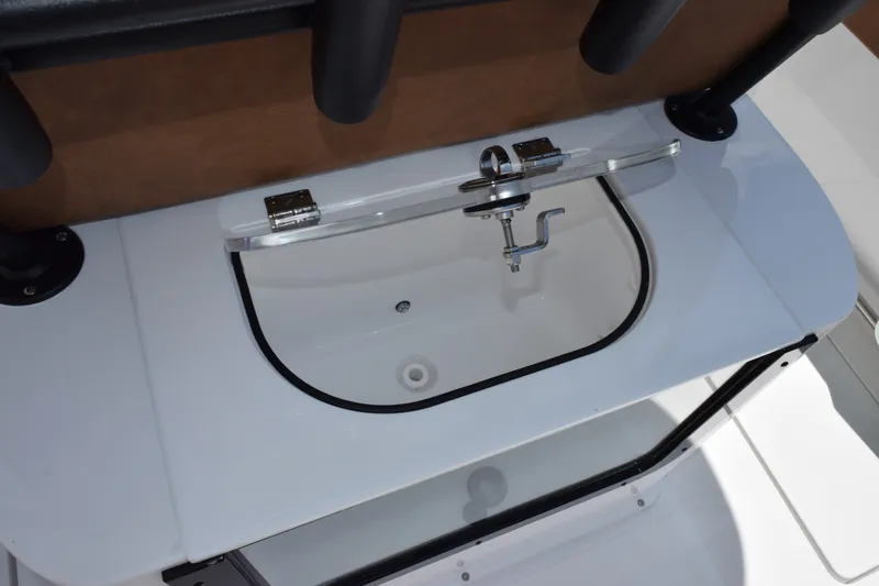 Slide: The Image of Livewell on 2027 Sea Hunt Gamefish 27FS boat, featuring a sleek design and modern faucet. - 25