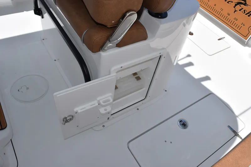 Slide: The Image of Interior view of 2027 Sea Hunt Gamefish 27FS boat with open storage compartment. - 20