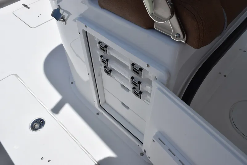 Slide: The Image of Storage compartment on 2027 Sea Hunt Gamefish 27FS boat, featuring secure latches and sleek design. - 21