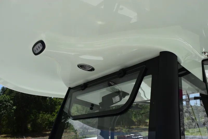 Slide: The Image of 2027 Sea Hunt Gamefish 27FS boat canopy and window detail. - 14