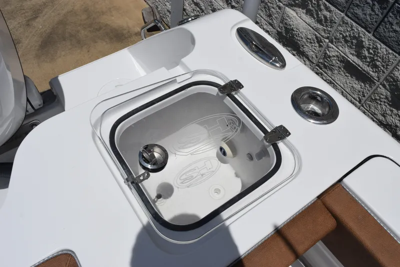 Slide: The Image of Livewell compartment on a 2027 Sea Hunt Gamefish 27FS boat, featuring stainless steel hardware. - 22
