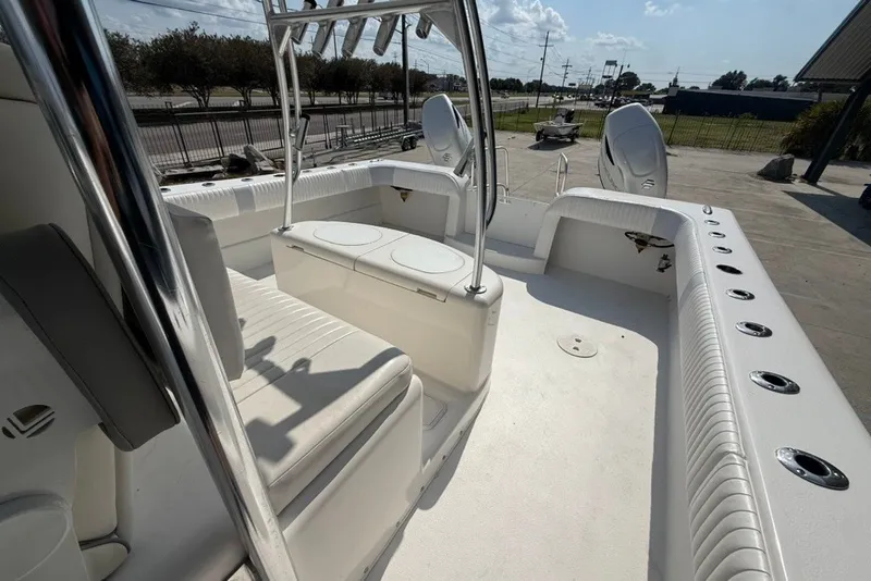 Slide: The Image of 2018 Twin Vee 36 Center Console boat interior with seating and rod holders. - 17