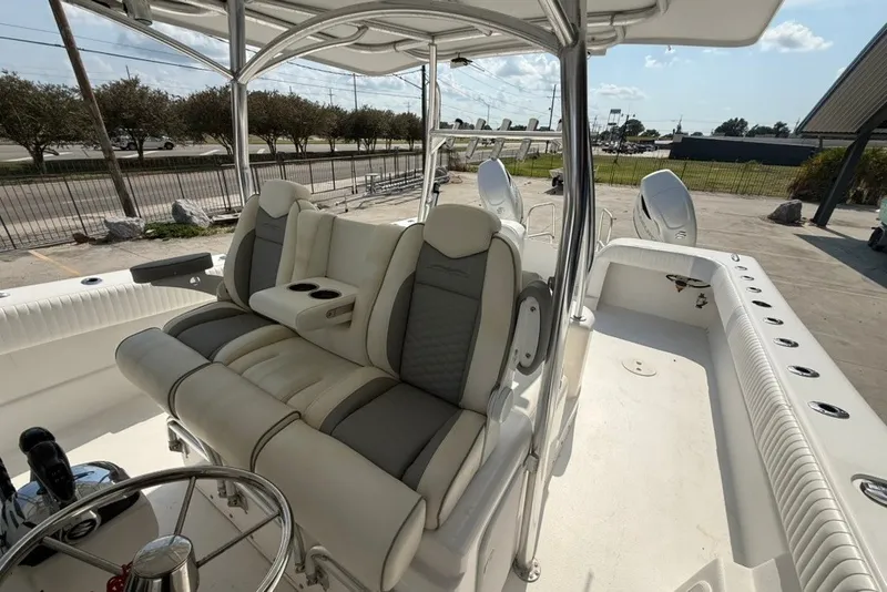 Slide: The Image of 2018 Twin Vee 36 Center Console boat interior with cushioned seating and steering wheel. - 18