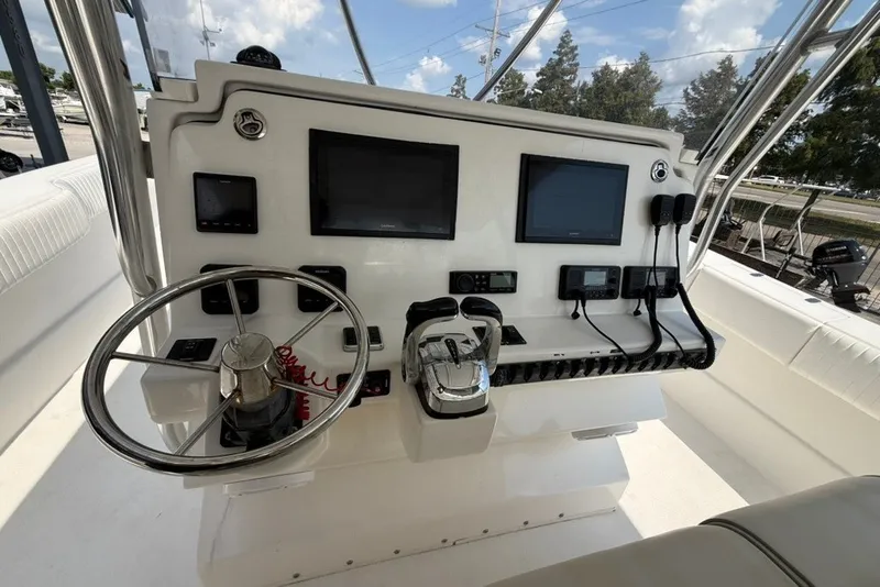 Slide: The Image of 2018 Twin Vee 36 Center Console helm with dual screens and steering wheel. - 19