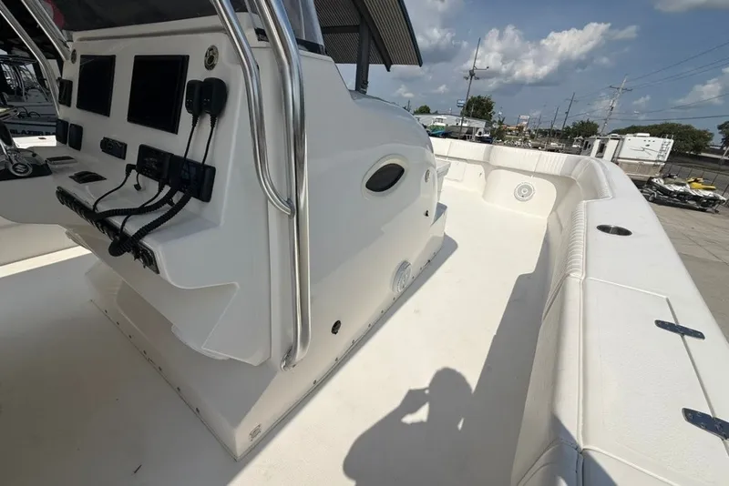 Slide: The Image of 2018 Twin Vee 36 Center Console boat interior with control panel and seating area. - 22