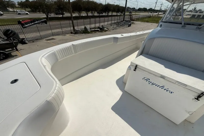 Slide: The Image of 2018 Twin Vee 36 Center Console boat deck with seating and storage box labeled "Royalties." - 30