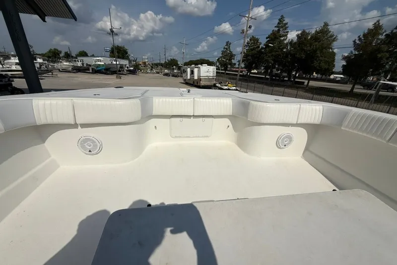 Slide: The Image of 2018 Twin Vee 36 Center Console boat interior with white seating and speakers. - 28