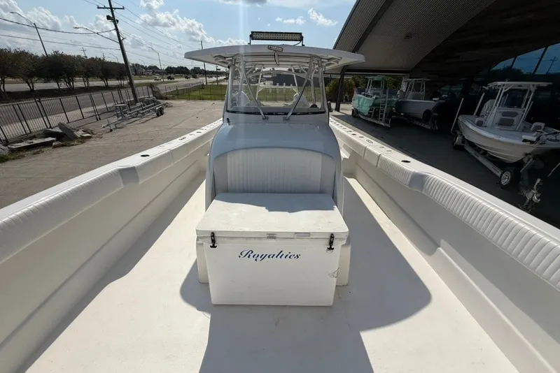 Slide: The Image of 2018 Twin Vee 36 Center Console boat with seating and storage, docked outdoors. - 29