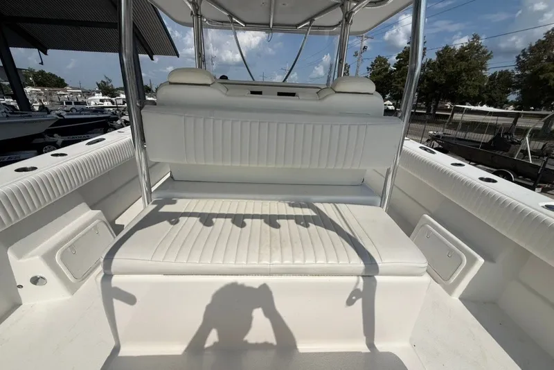 Slide: The Image of 2018 Twin Vee 36 Center Console boat interior with white seating and rod holders. - 16