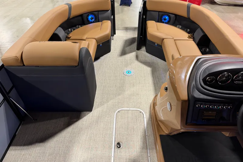 Slide: The Image of Luxurious interior of 2027 Trifecta 24 ULCS 3.0 pontoon boat with plush seating and modern dashboard. - 18