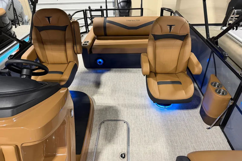 Slide: The Image of Luxurious interior of 2027 Trifecta 24 ULCS 3.0 pontoon boat with tan seating. - 14