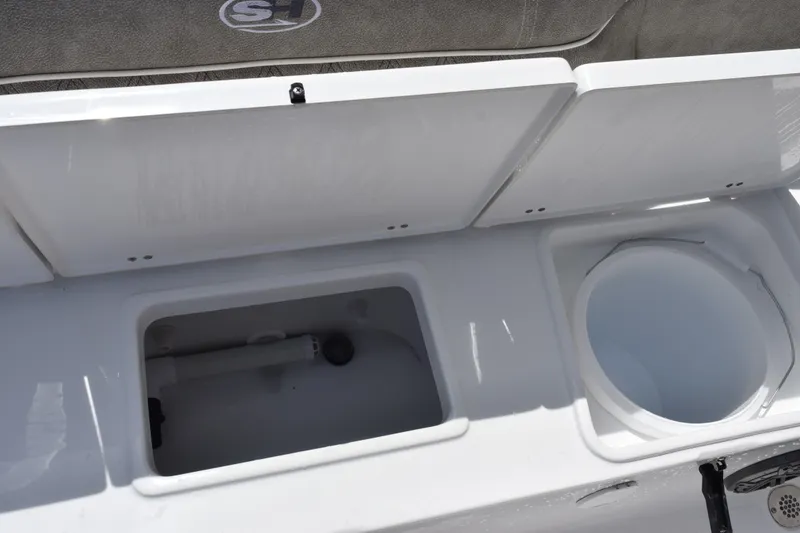 Slide: The Image of 2027 Sea Hunt Ultra 229 boat storage compartments and seating area. - 20