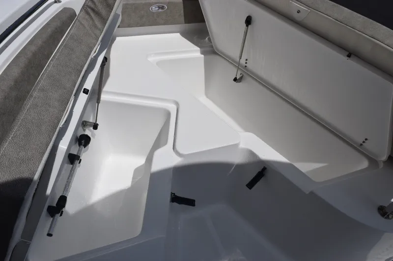 Slide: The Image of Interior view of 2027 Sea Hunt Ultra 229 boat with open storage compartments. - 14
