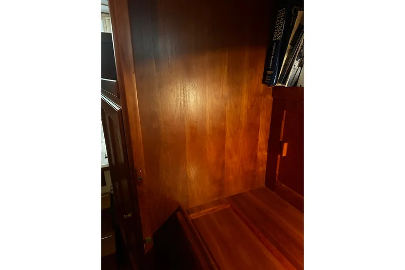 Slide: The Image of Wooden interior of 1998 Northern Bay 36 boat with books on shelf. - 12