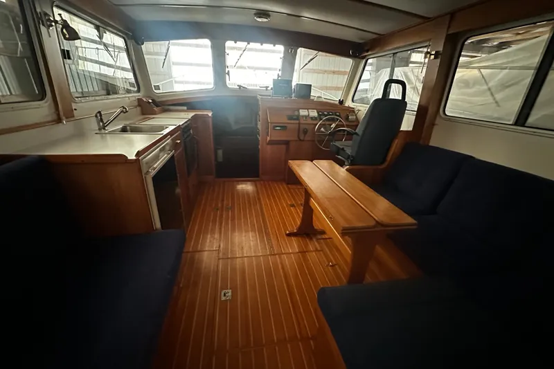 Slide: The Image of Interior of 1998 Northern Bay 36 boat with wood flooring and seating area. - 7