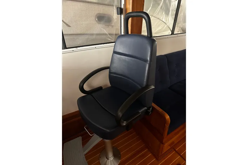 Slide: The Image of Captain's chair on 1998 Northern Bay 36 boat, featuring sleek design and comfortable seating. - 32
