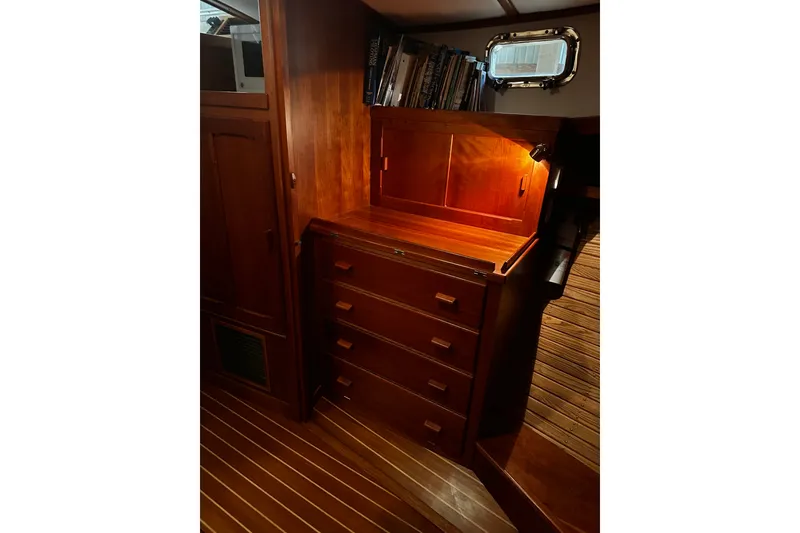 Slide: The Image of Interior of 1998 Northern Bay 36 boat with wooden cabinetry and bookshelves. - 11