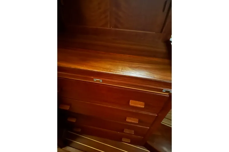 Slide: The Image of Wooden cabinetry inside a 1998 Northern Bay 36 boat, showcasing polished drawers and rich finish. - 14