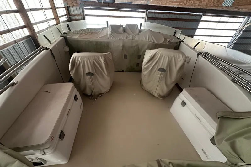 Slide: The Image of Interior of a 1998 Northern Bay 36 boat with covered seating and storage. - 21
