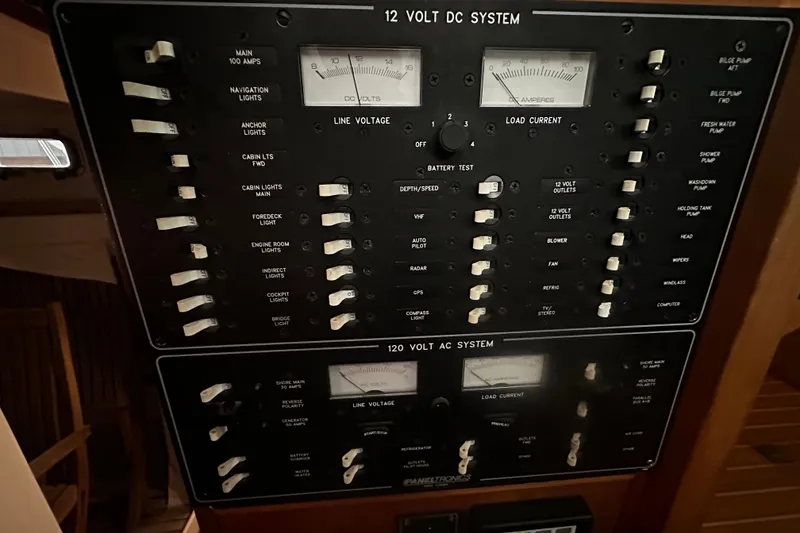 Slide: The Image of Electrical panel of a 1998 Northern Bay 36 boat, featuring 12V DC and 120V AC systems. - 35