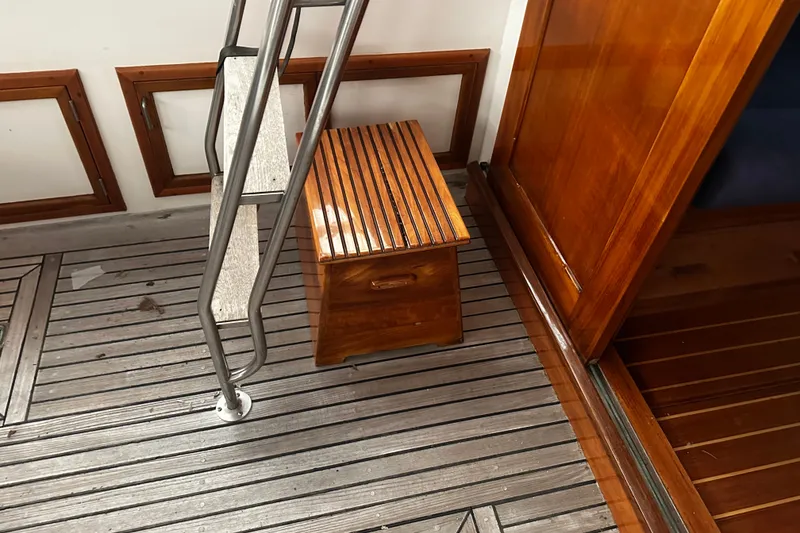 Slide: The Image of Interior of 1998 Northern Bay 36 boat with wooden flooring and ladder. - 26