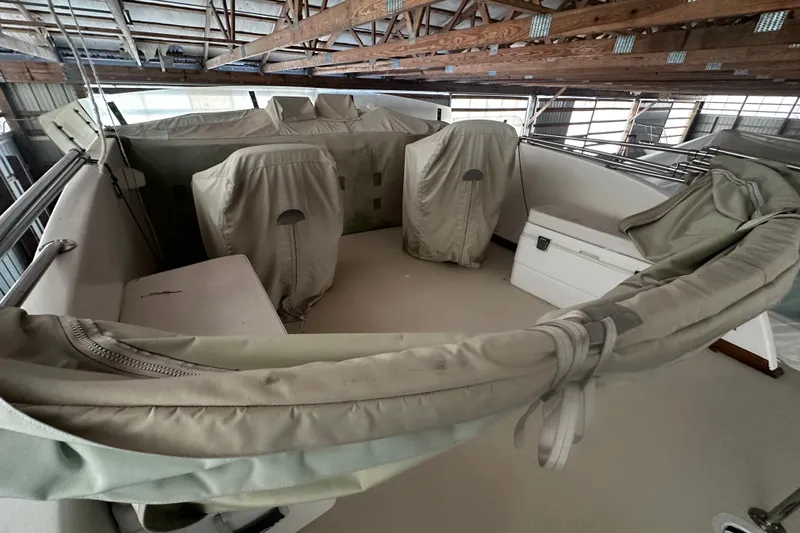 Slide: The Image of Interior of a 1998 Northern Bay 36 boat with covered seating and storage. - 22