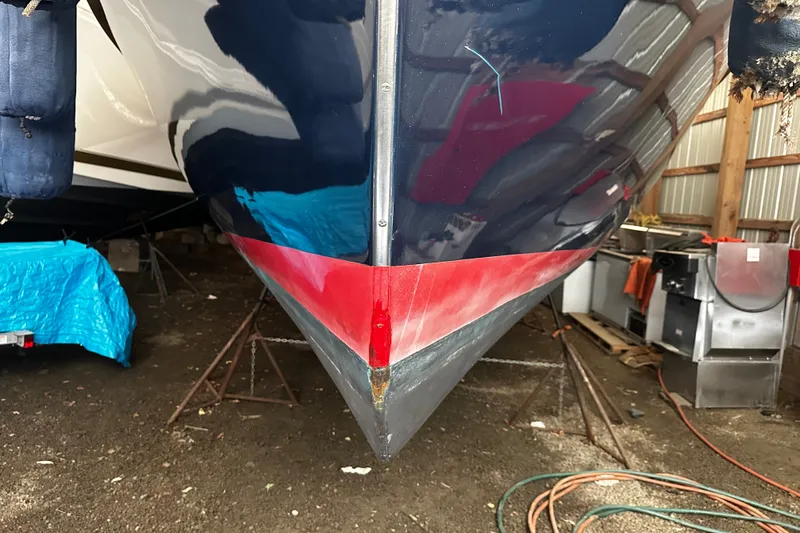 Slide: The Image of Bow view of a 1998 Northern Bay 36 boat in a storage shed. - 17