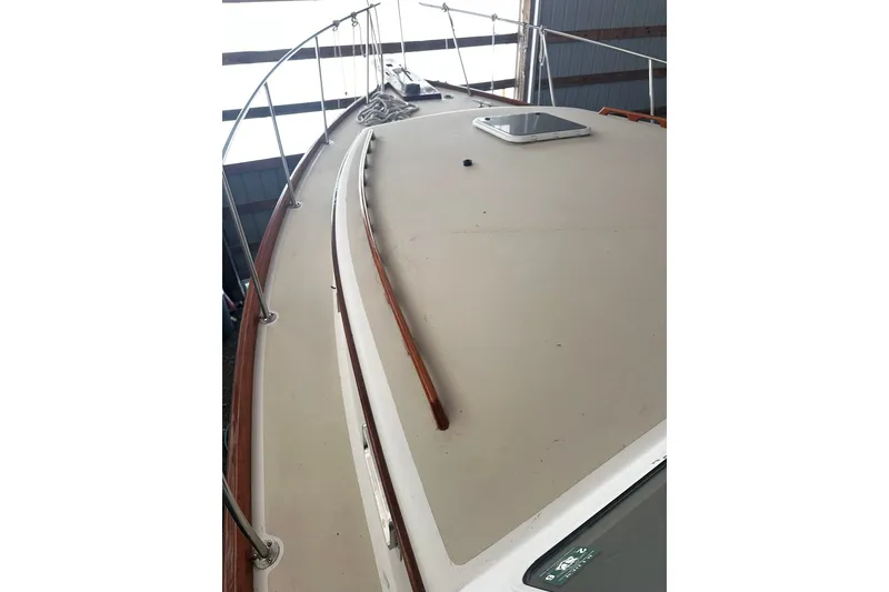 Slide: The Image of 1998 Northern Bay 36 boat deck with railing and hatch, viewed from above. - 30